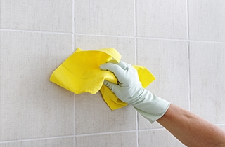 Tile scrubbing with yellow cloth