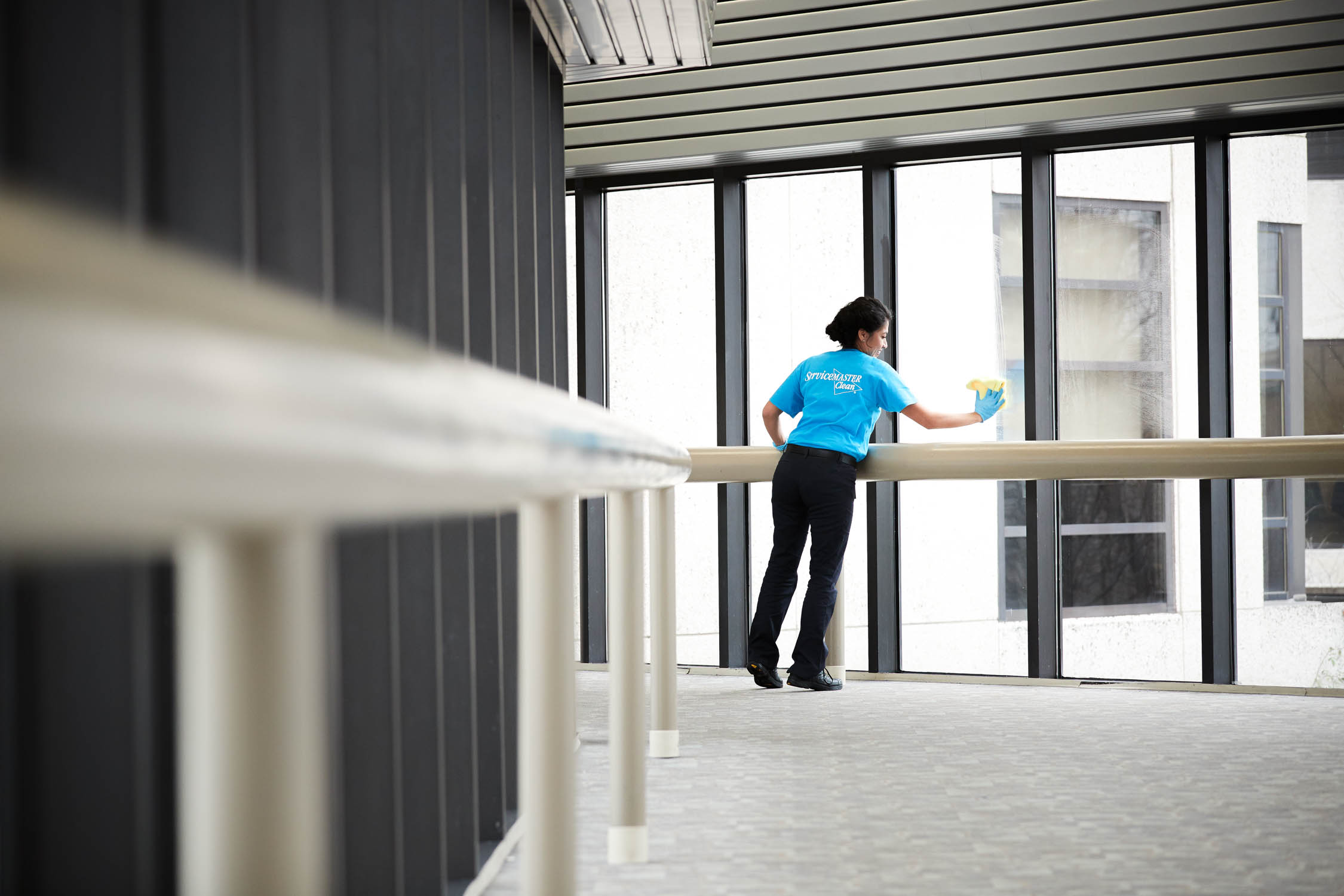 Woman cleaning window