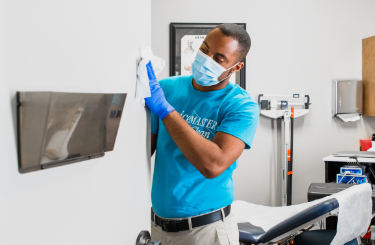 A ServiceMaster team member cleans a doctor’s office during healthcare cleaning services in Sarasota, Florida